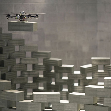 Drones while constructing a tall tower