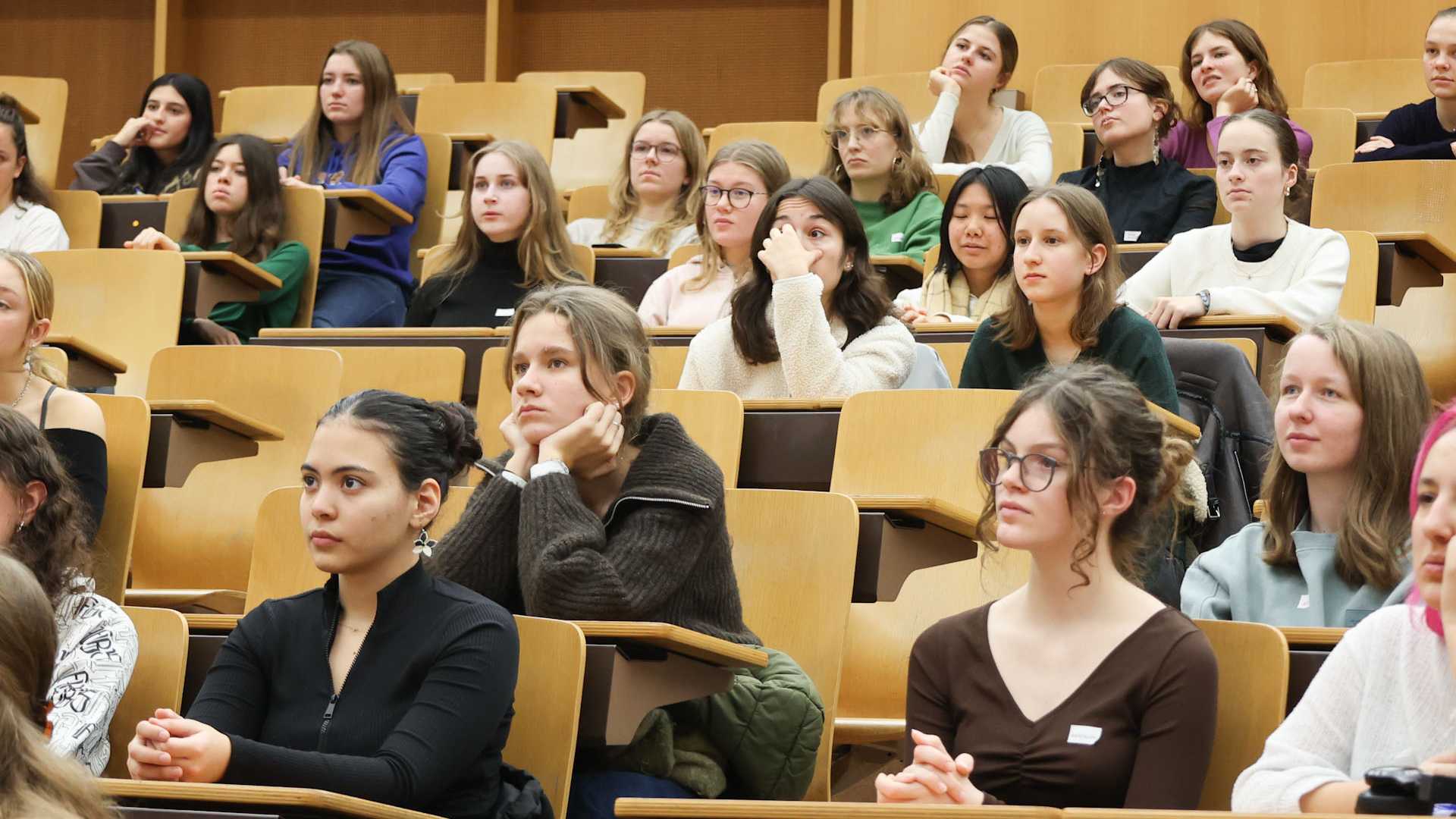 The schoolgirls listened with interest to the presentations.