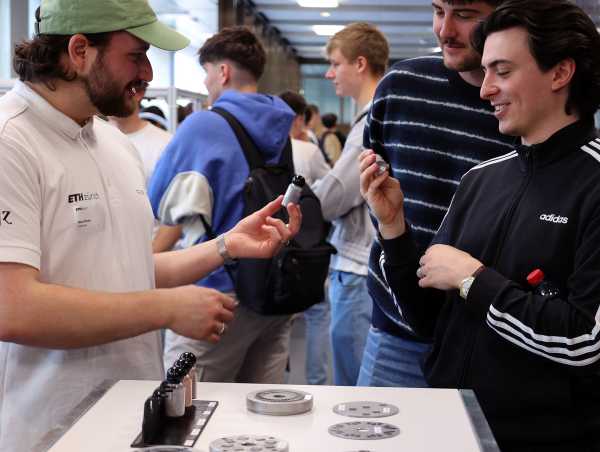 Enlarged view: Student explains printing technology to visitors