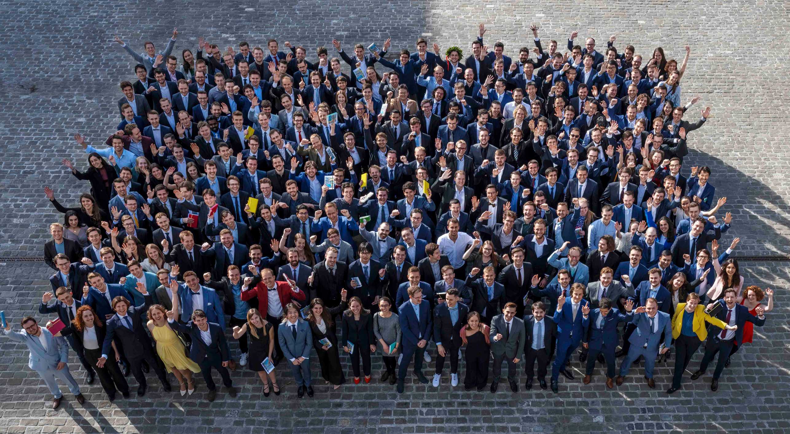 Group photo of all graduates in front of the HPH building.