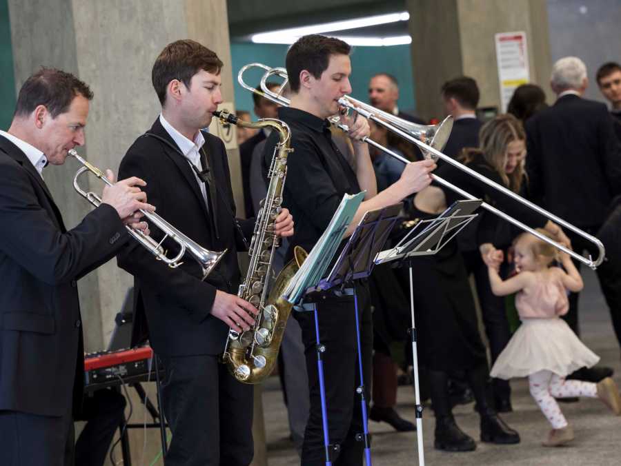 Three musicians playing music.